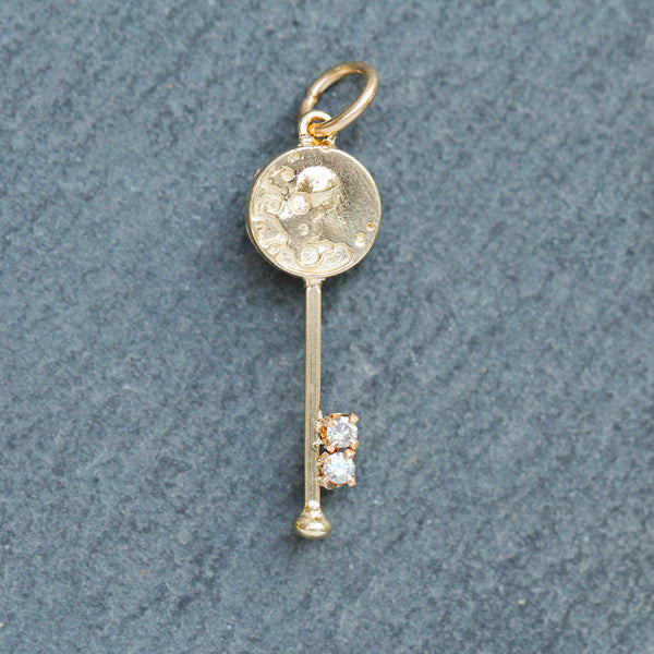 vintage gold key, skeleton key, with 2 small diamonds at the base